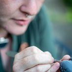 Amberlea McNaught carving a small pot for Celebrating Ceramics’ Make Mine Miniature competition